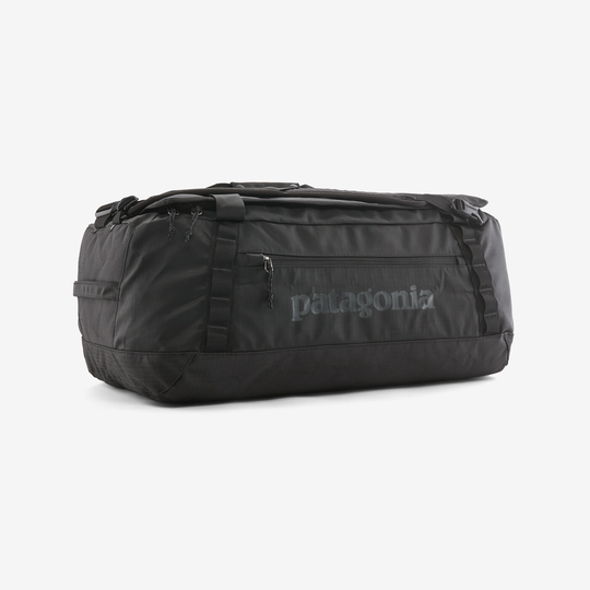 Black Hole Duffel 55L bag in black on white background, robust and travel-ready.