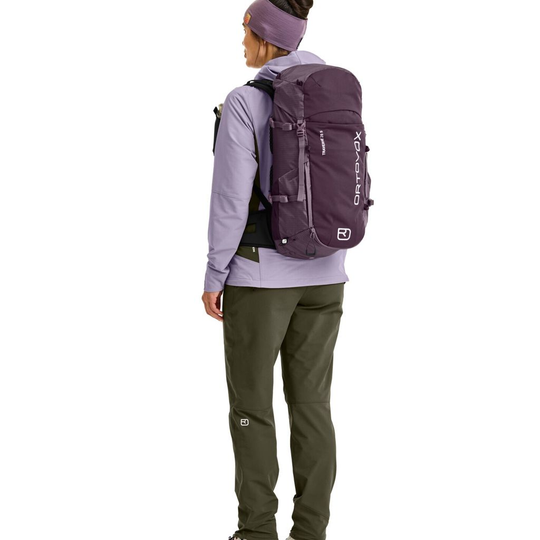 Traverse 28 S purple backpack worn by a person with outdoor gear.