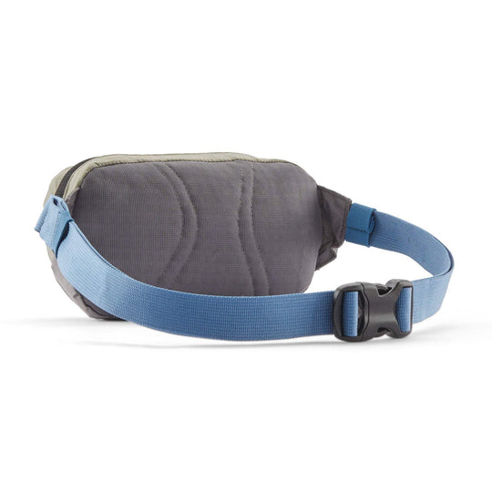 Terravia Mini Hip Pack with blue adjustable strap, lightweight design, and durable recycled materials.