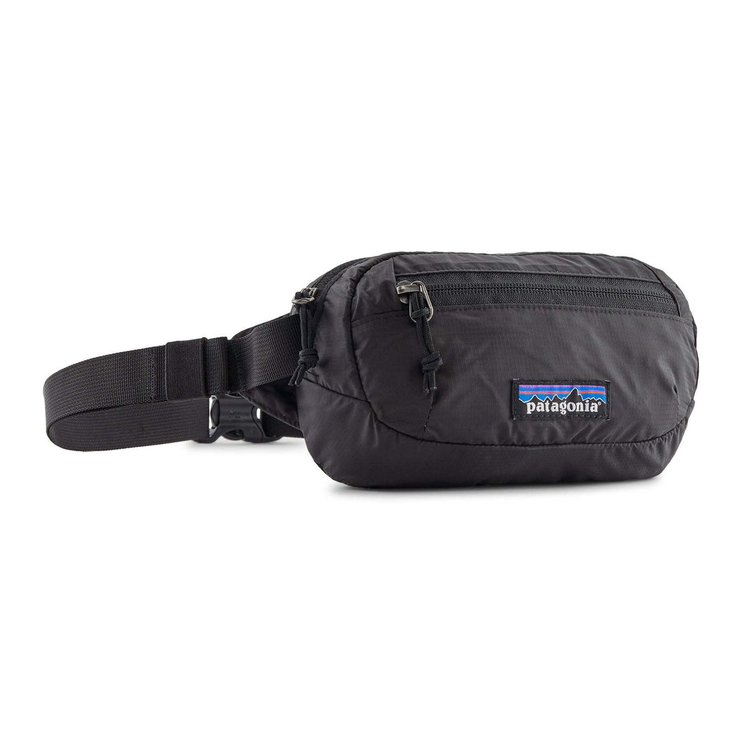 Terravia Mini Hip Pack, black, lightweight, 1-liter capacity, versatile wear options, made from 100% recycled materials, Fair Trade Certified, multiple pockets, adjustable.