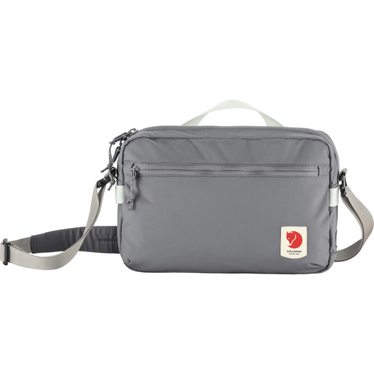 High Coast Crossbody bag, lightweight and functional, gray with adjustable strap, perfect for travel, city errands, made from recycled polyamide.