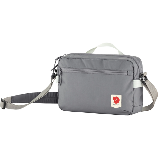 High Coast Crossbody bag in gray, lightweight, functional with adjustable strap and multiple pockets.