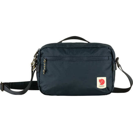 High Coast Crossbody bag, lightweight and functional, with adjustable strap and multiple pockets.