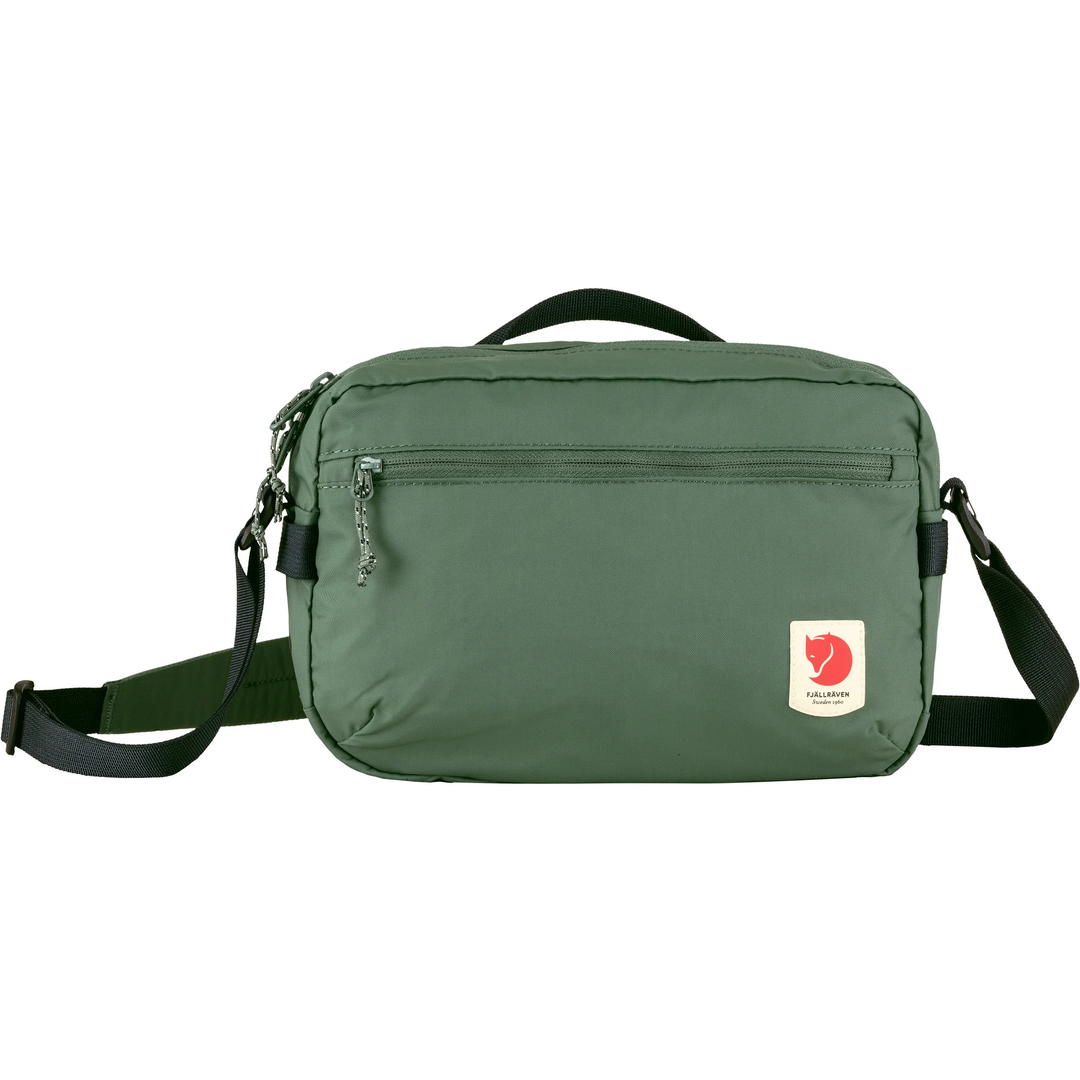 High Coast Crossbody lightweight green bag with adjustable strap and front zipper pocket.