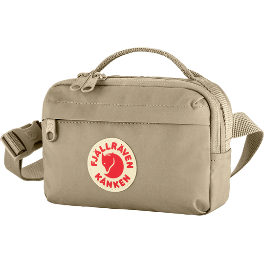 Kånken Hip Pack in beige with adjustable strap and multiple compartments.