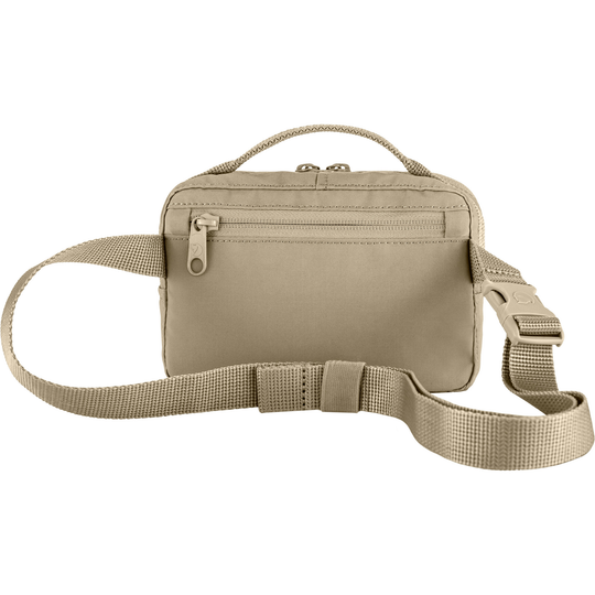 Kånken Hip Pack beige, compact and durable, with adjustable strap and multiple zippered pockets.