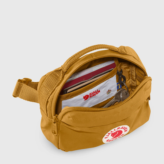 Kånken Hip Pack made from durable, waterproof Vinylon F fabric, featuring main compartment, internal pocket, key clip, and two external zippered pockets.