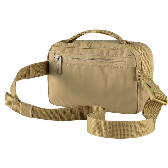 Kånken Hip Pack in Vinylon F fabric, beige color, with adjustable strap and zippered pockets.