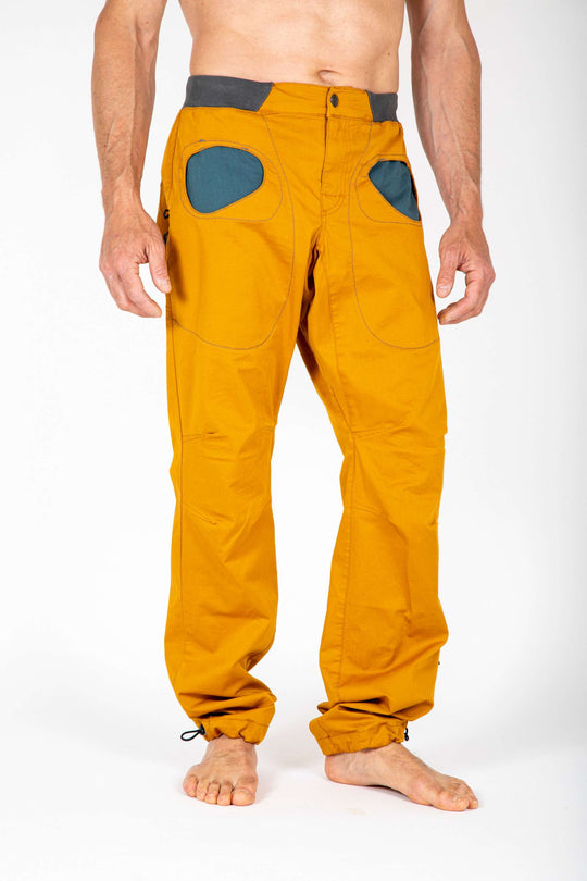 Outdoor climbing pants made of organic cotton gabardine with unique pocket design and adjustable features.