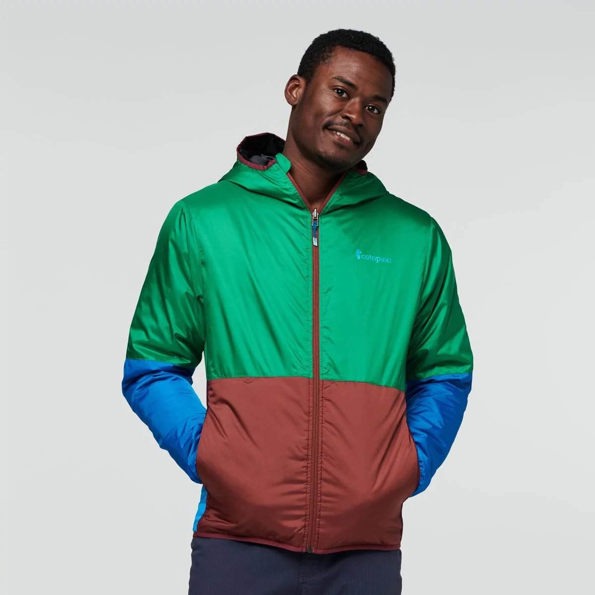 Reversible Teca Calido Hooded Jacket with recycled insulation and vibrant colors.