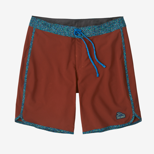 Hydropeak Scallop Boardshorts (18 In) in rust color with blue accents, featuring lightweight, quick-dry recycled polyester and elastane fabric, scallop hem, secure drawcord, and Fair Trade Certified production.