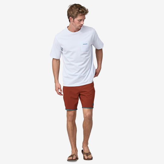 Men's wearing Hydropeak Scallop Boardshorts (18 In.), lightweight, four-way stretch, quick-dry fabric, red color.