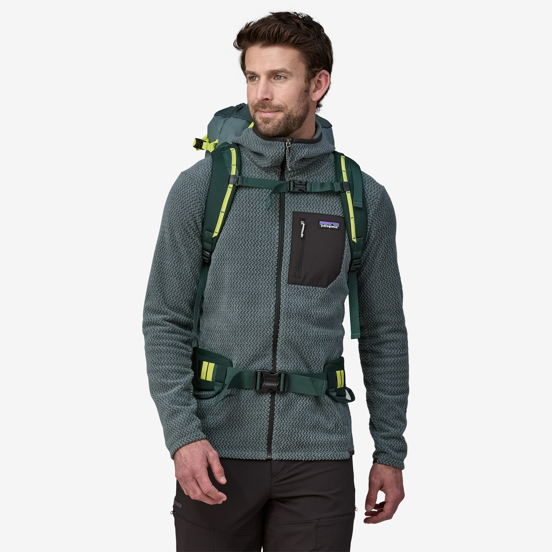 Ascensionist 35L backpack being worn by a person, showing its compact and functional design for alpine climbing.