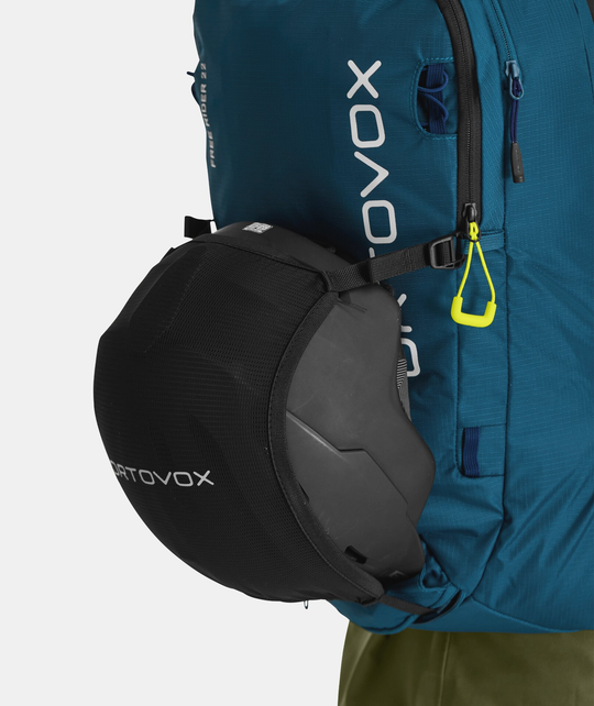 Compact Free Rider 22 backpack with helmet attachment and ergonomic design.