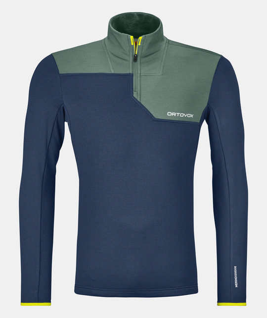 Fleece Light Zip Neck M in blue and green, lightweight and warm pullover ideal for winter sports, with Merino wool for comfort and breathability.