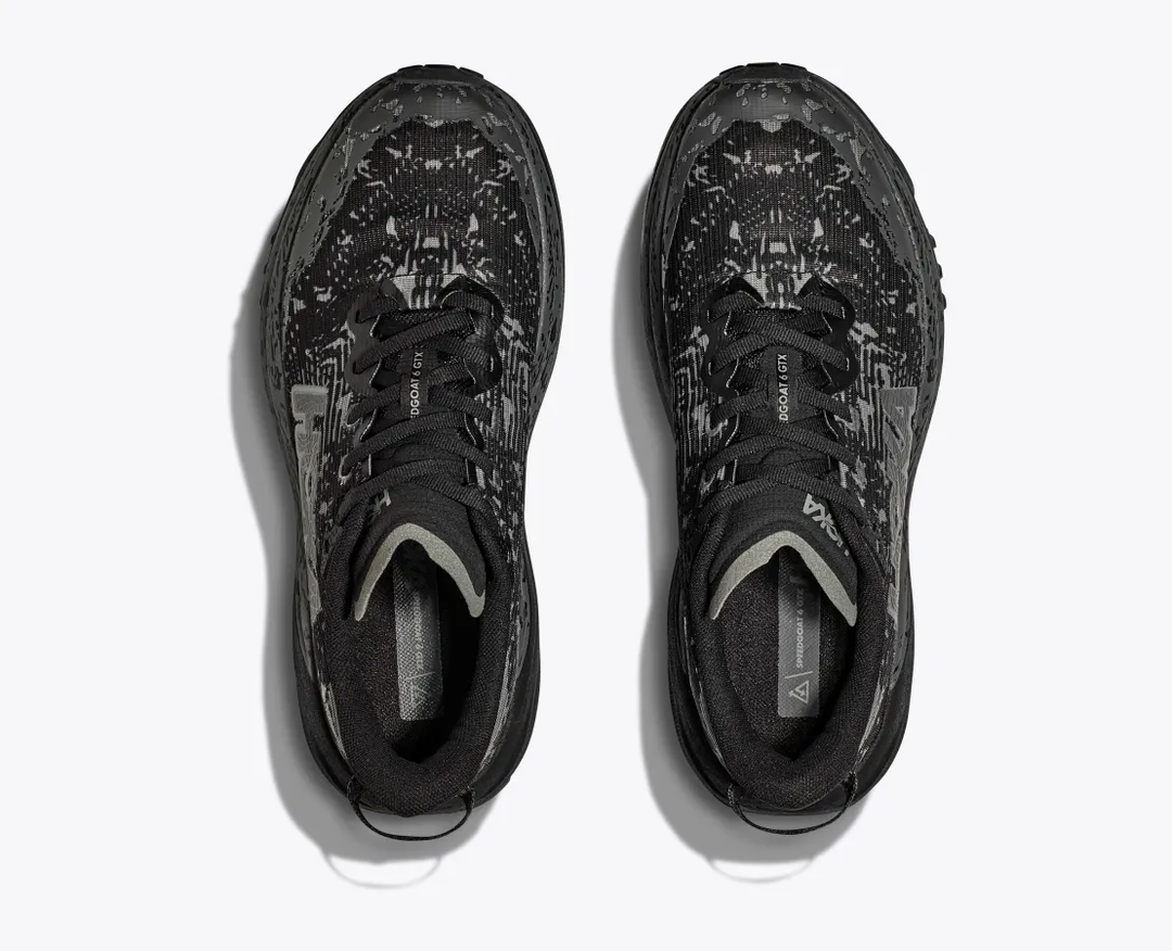 Women's Hoka Speedgoat 6 GTX trail shoes with GORE-TEX Invisible Fit, black design.