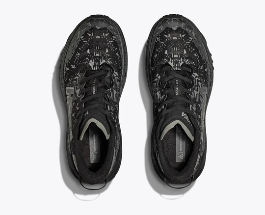 Women's Hoka Speedgoat 6 GTX trail shoes with GORE-TEX Invisible Fit, black design.