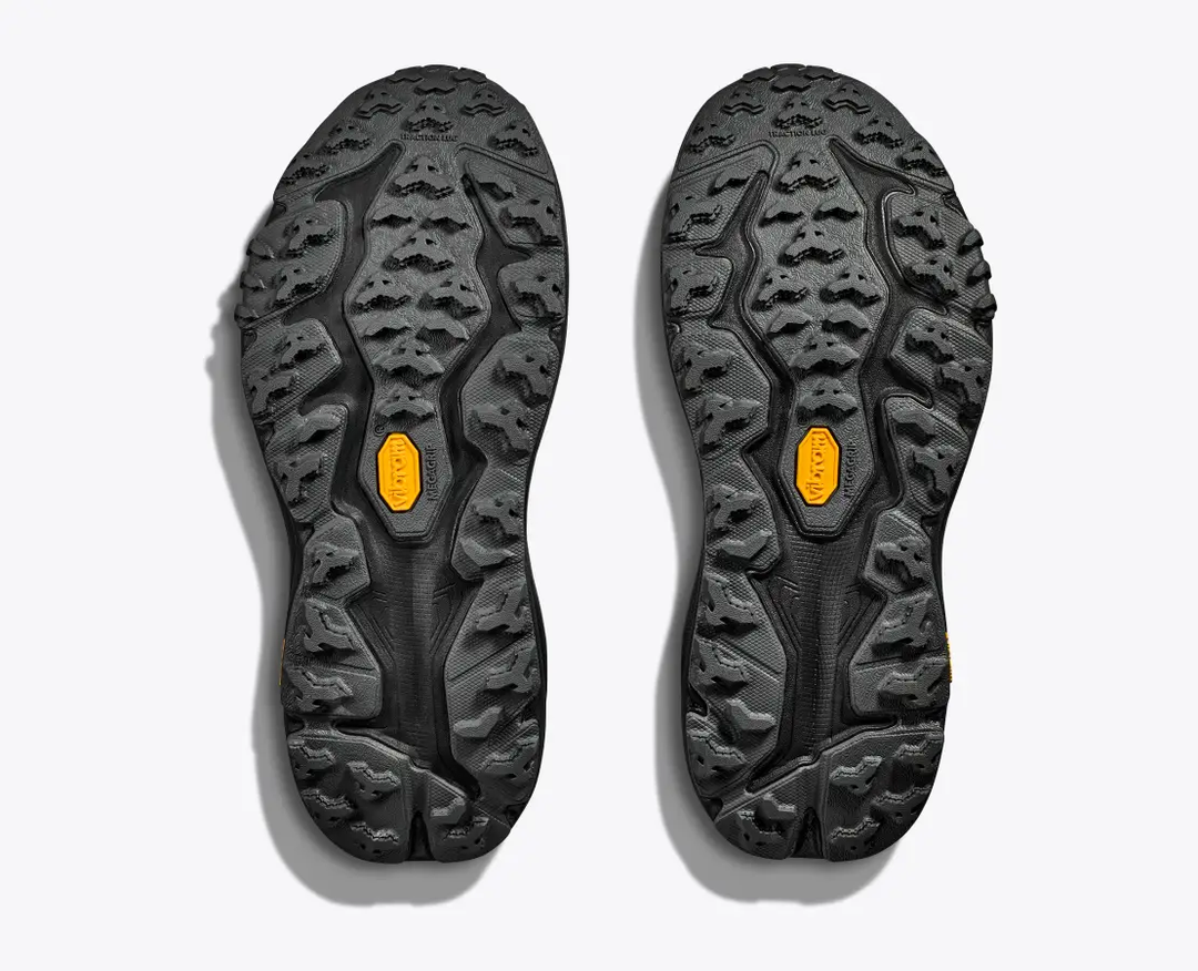 Soles of W Speedgoat 6 GTX trail shoes with Vibram® Megagrip for enhanced traction.