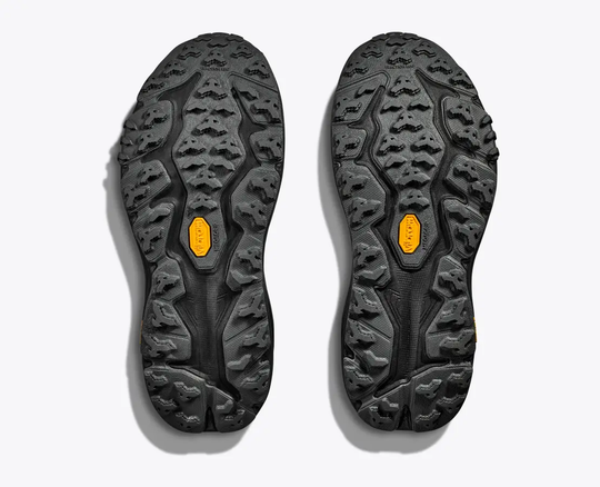 Soles of W Speedgoat 6 GTX trail shoes with Vibram® Megagrip for enhanced traction.