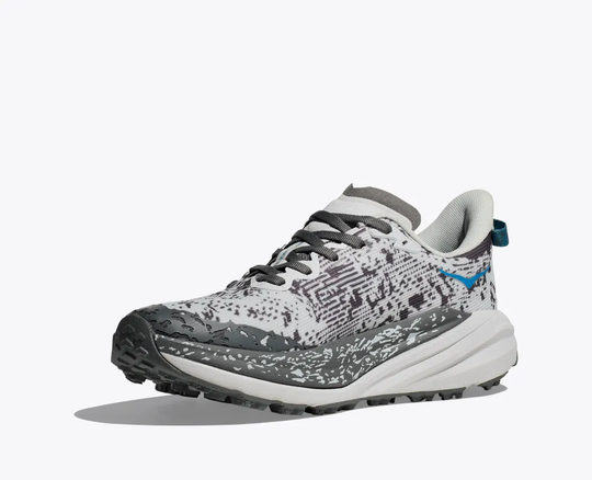 Trail shoe 'W Speedgoat 6 GTX' with GORE-TEX membrane and Vibram Megagrip sole, designed for wet conditions and hiking.