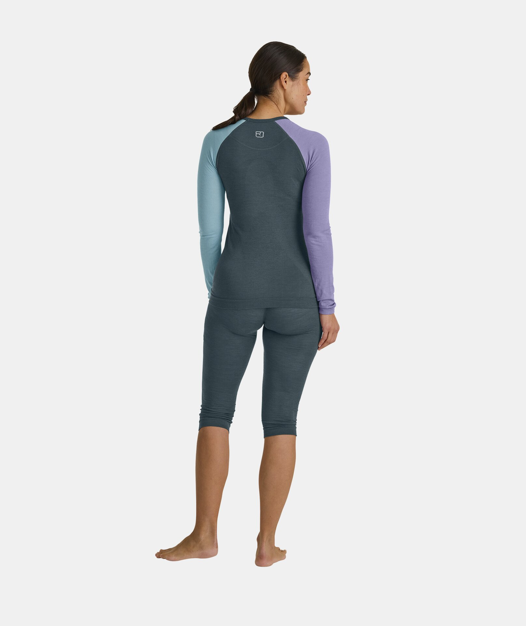 Women's 120 Comp Light Long Sleeve in multi-colored merino, showcasing breathable and seamless design for high-movement activities.