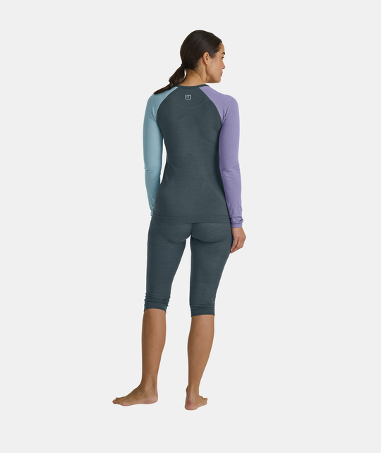 Women's 120 Comp Light Long Sleeve in multi-colored merino, showcasing breathable and seamless design for high-movement activities.
