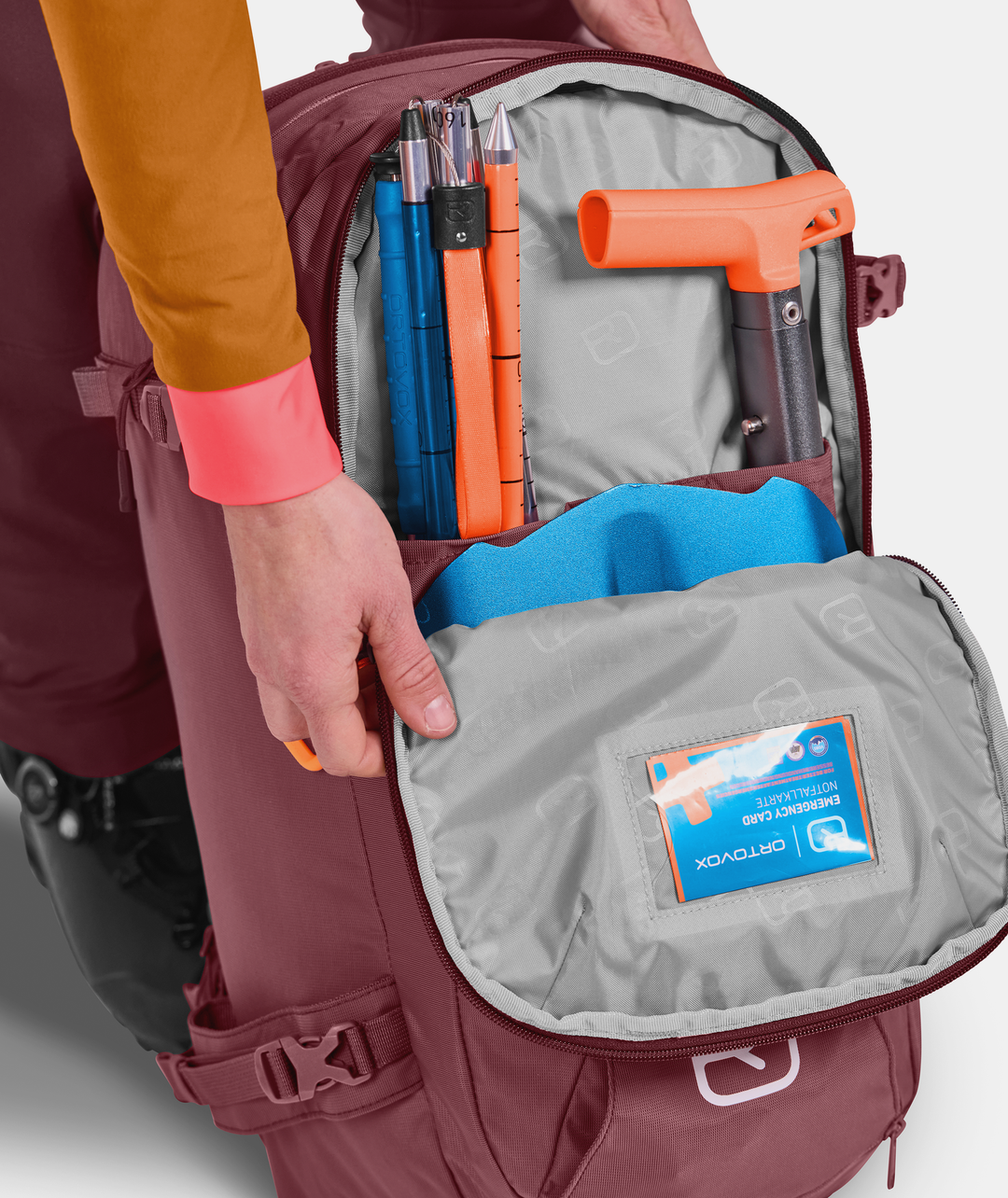 Backside view of the Haute Route 30 S backpack with organized ski mountaineering gear inside.