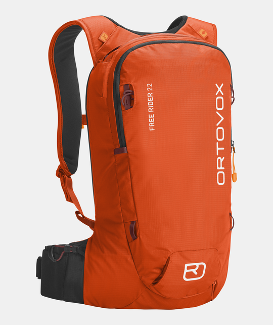Compact and versatile Free Rider 22 backpack in orange, designed for freeride with ergonomic and flexible features, including integrated helmet net and safety compartments.