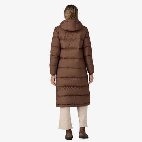 Long brown parka with hood and knee-length design.