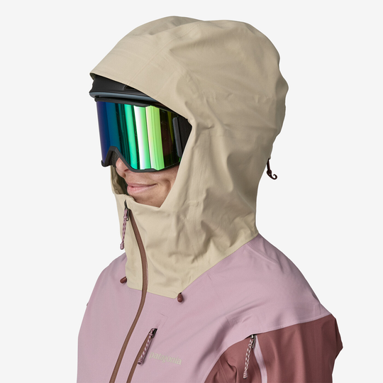 Snowdrifter Jkt women's jacket in pink with helmet-compatible hood and adjustable features.