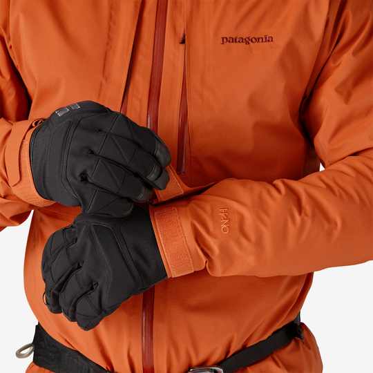 Orange M10 Storm Jkt with adjustable cuffs and H2No™ Performance Standard, shown with black gloves.