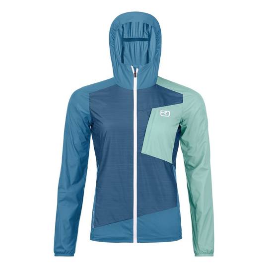 Lightweight windbreaker jacket for women in blue and teal, featuring ergonomic cut, Merino wool blend, and TEC-STRETCH material.