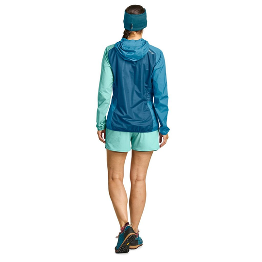 Lightweight women's windbreaker jacket with Merino wool, blue design, ideal for alpine excursions.