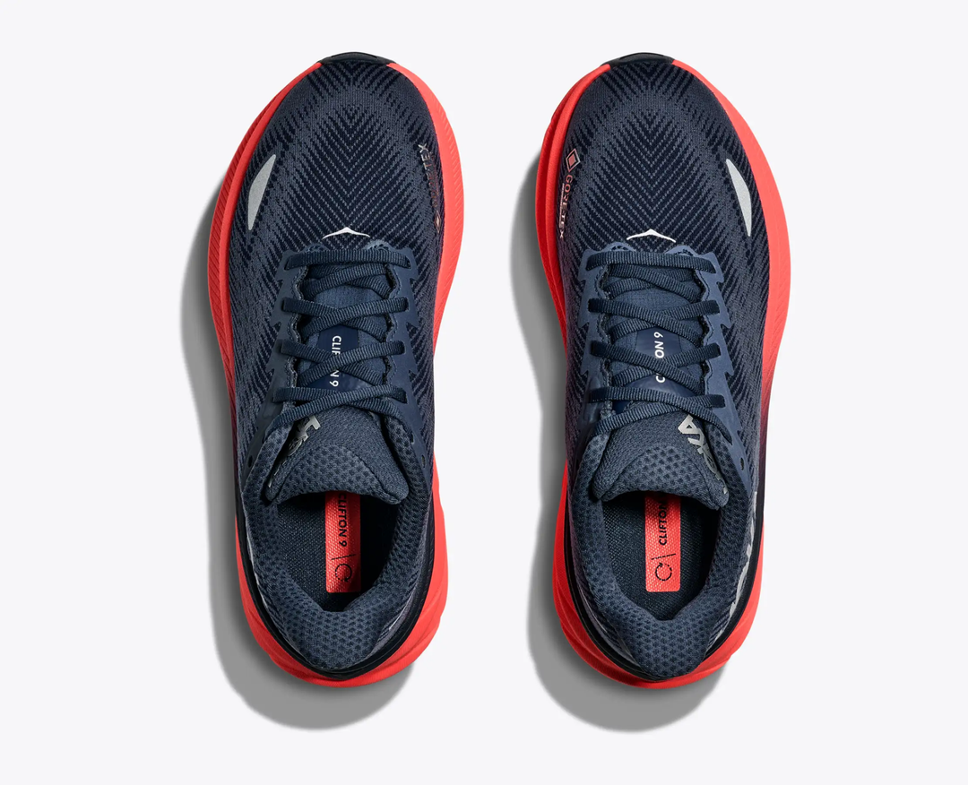Clifton 9 Gtx running shoes with GORE-TEX, navy upper, coral sole, top view.