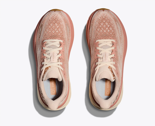 Clifton 9 running shoes, lightweight design in a pink and beige colorway with breathable mesh upper and streamlined laces.