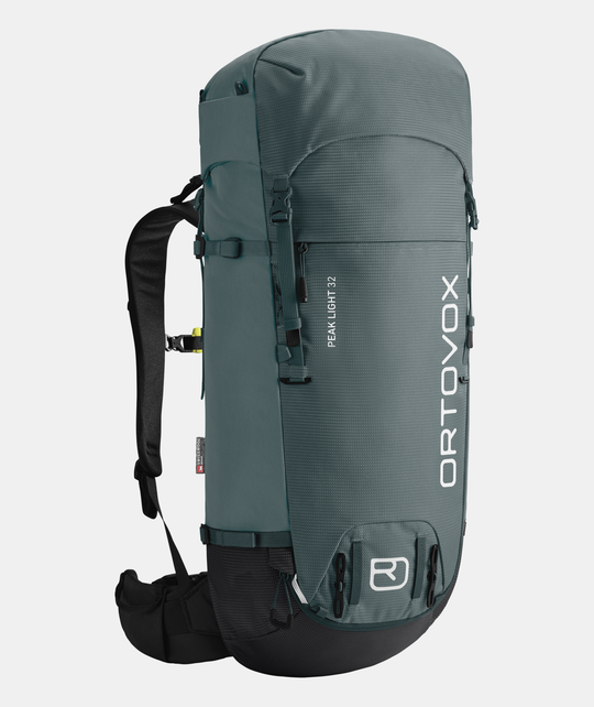 Peak Light 32 backpack for alpine trekking, featuring a lightweight, sustainable design with Swisswool Hybrid Back System.