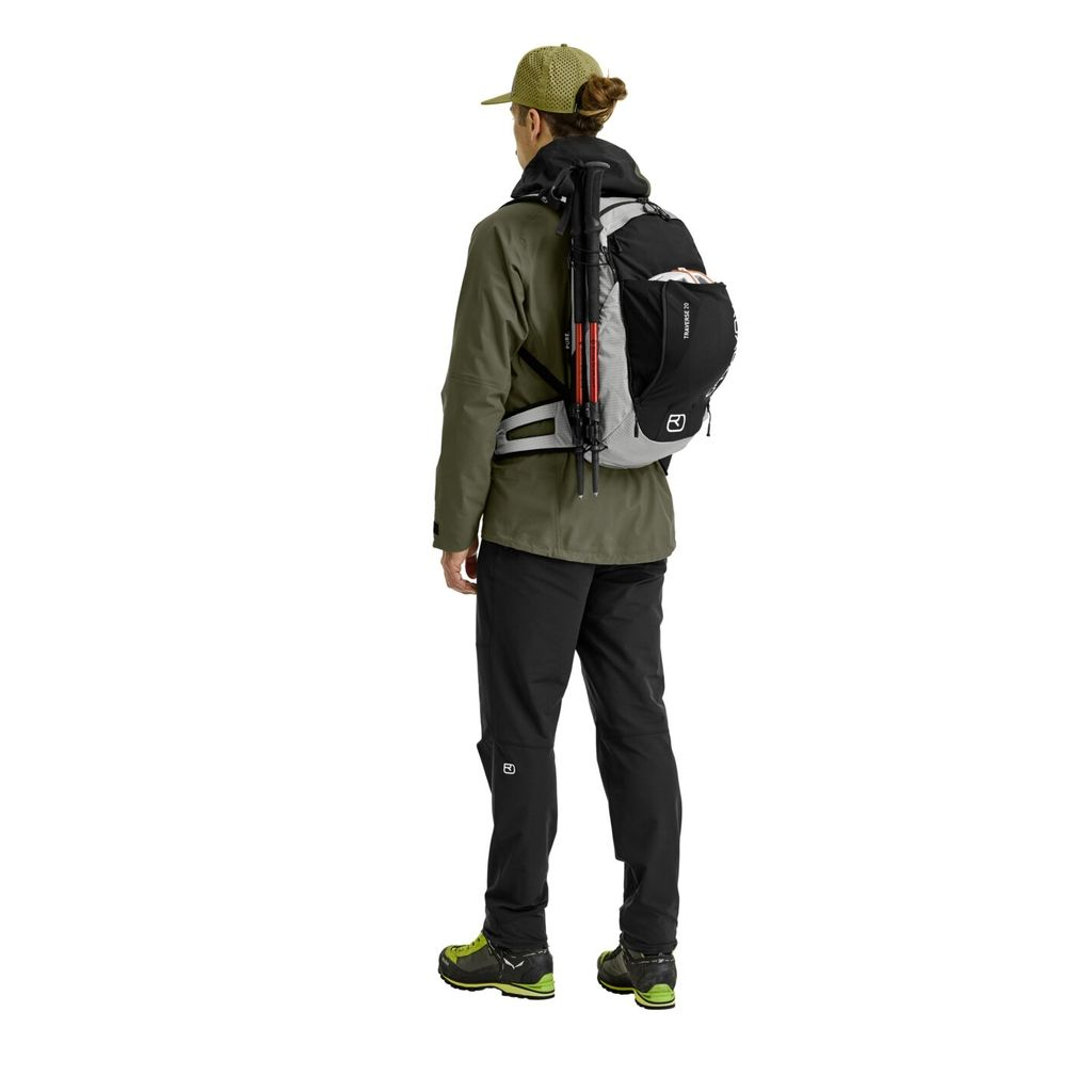Versatile alpine backpack Traverse Pure 20 worn by hiker, featuring ergonomic design and eco-friendly materials.