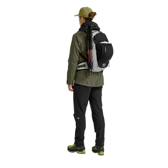 Versatile alpine backpack Traverse Pure 20 worn by hiker, featuring ergonomic design and eco-friendly materials.