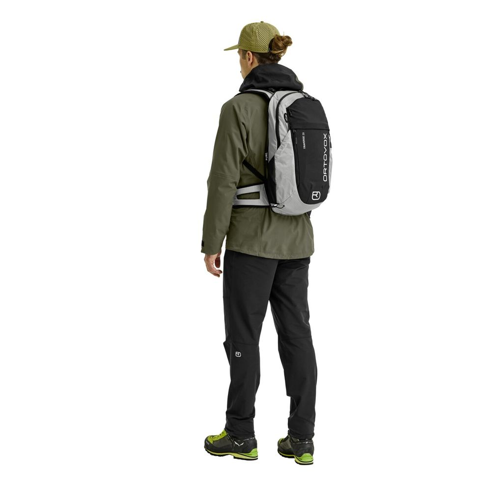 Traverse Pure 20 backpack on person; versatile, eco-friendly alpine gear.