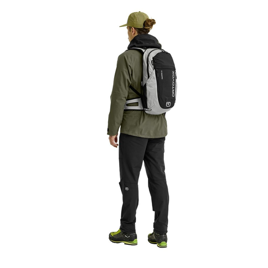 Traverse Pure 20 backpack on person; versatile, eco-friendly alpine gear.