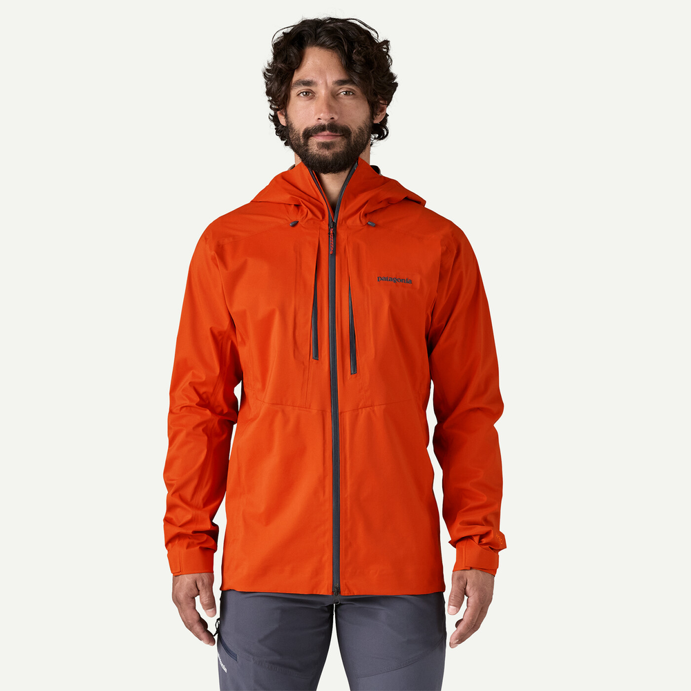 M10 Storm Jkt in orange, lightweight alpine jacket, 3-layer recycled nylon, adjustable hood, waterproof zippers, sustainable Fair Trade Certified.