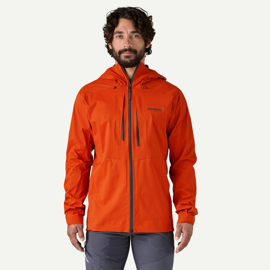 M10 Storm Jkt in orange, lightweight alpine jacket, 3-layer recycled nylon, adjustable hood, waterproof zippers, sustainable Fair Trade Certified.