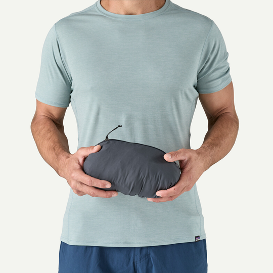 Nano-Air Ultralight Full-Zip Hoody packed in compact form being held by a person.