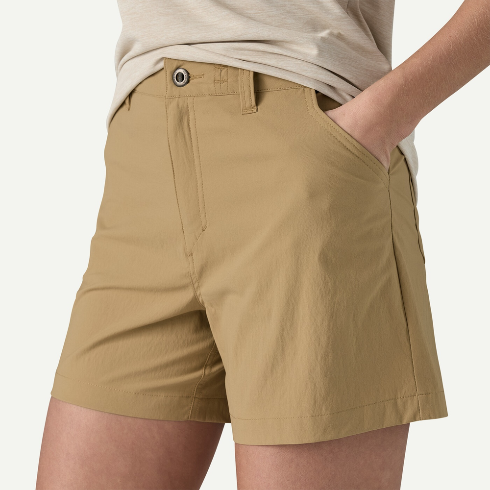 W's Quandary Shorts in beige, featuring a tailored fit with mid-rise waist, made from recycled nylon and elastane, designed for hiking and outdoor activities.