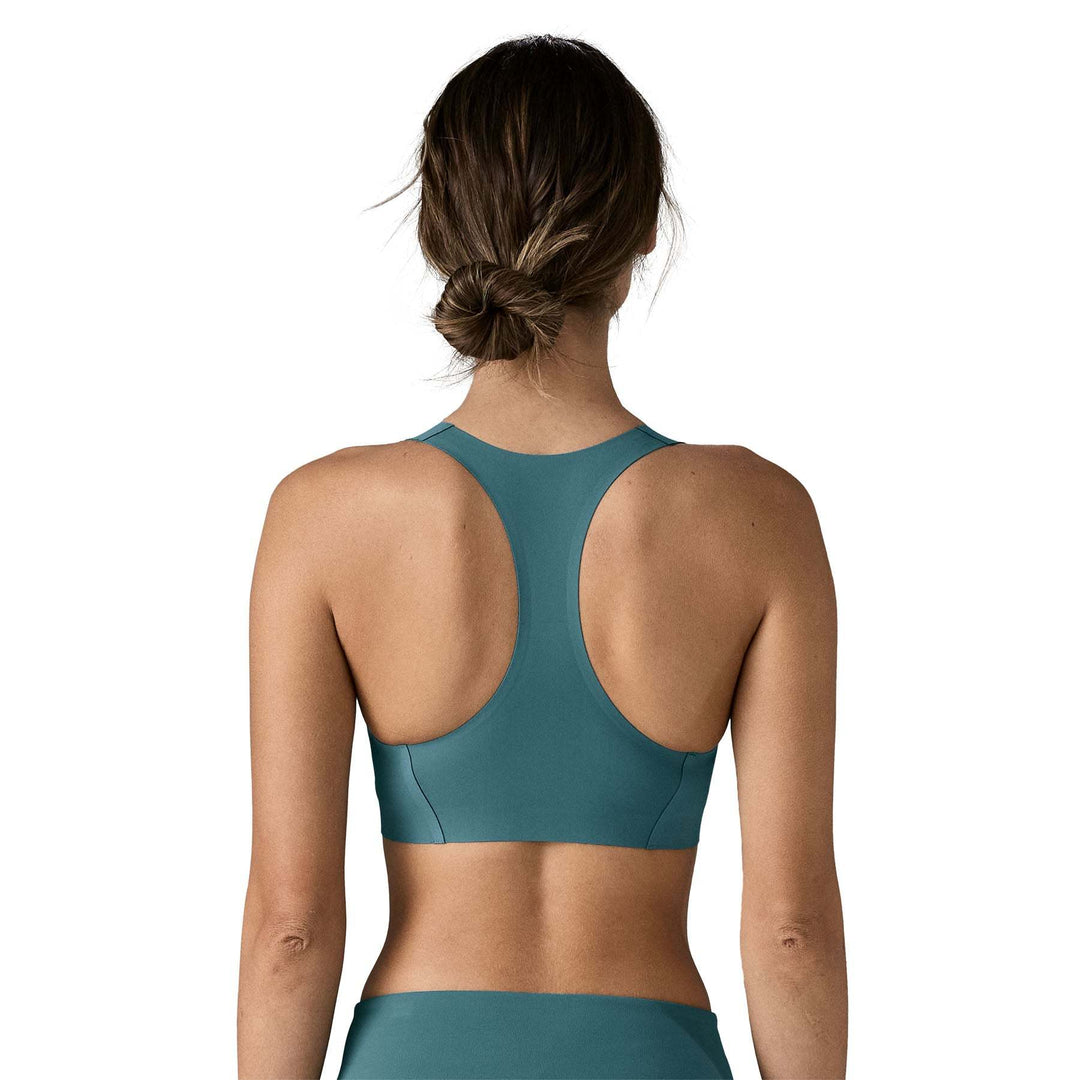 Women's Live Simply Bra with minimalist design and racerback style in soft teal fabric.