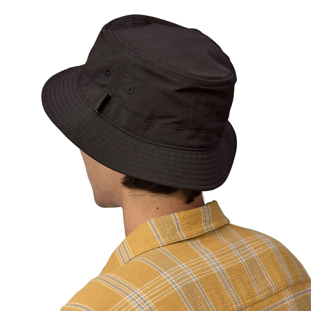Wavefarer Bucket Hat made from recycled nylon, shown on person from behind, featuring breathable and water-repellent fabric.