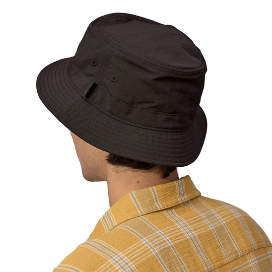 Wavefarer Bucket Hat made from recycled nylon, shown on person from behind, featuring breathable and water-repellent fabric.