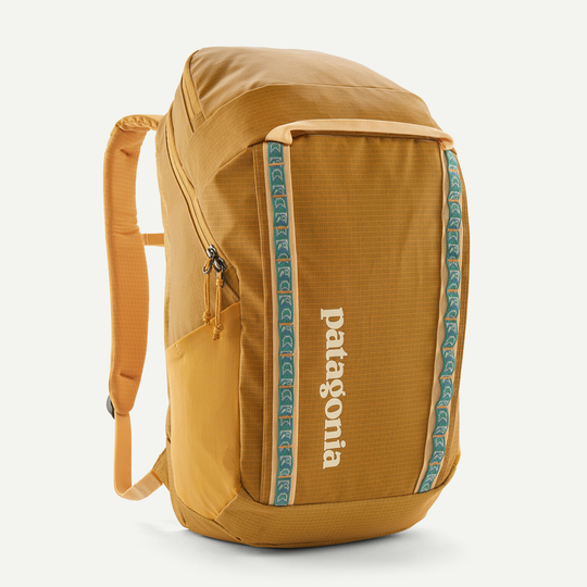 Black Hole Pack 32L backpack with recycled water-repellent fabric, spacious compartments, and laptop sleeve.