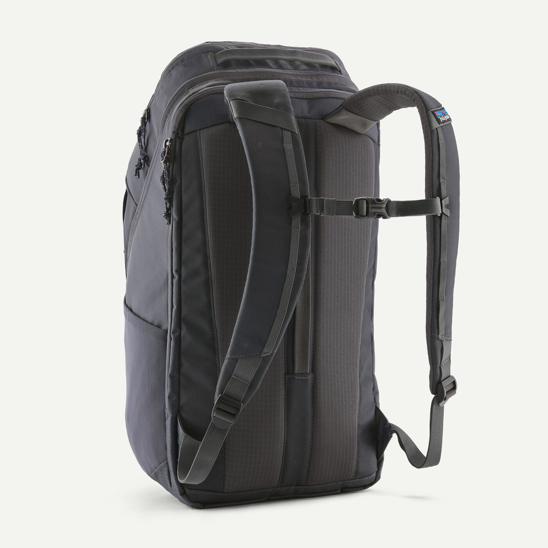 Black Hole Pack 32L backpack in black, featuring padded straps and breathable back panel.