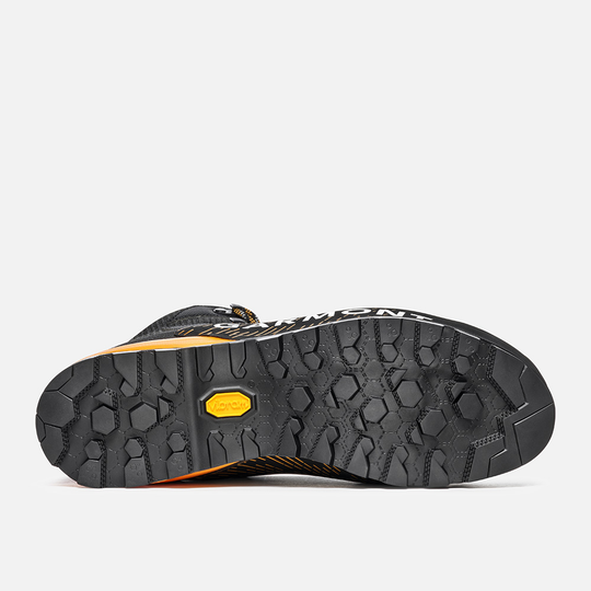 Boot sole of Tower 3.0 Gtx featuring Traction Lug technology for enhanced grip.